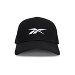 The Reebok Range Cap is a black baseball cap with a curved brim and a white Reebok logo on the front, shown from the front on a plain white background.