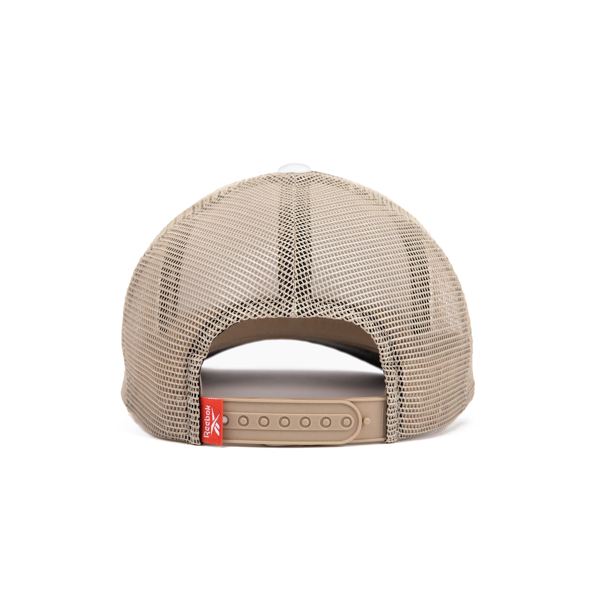 A beige Reebok Vintage Trucker Cap shown from the back, featuring an adjustable snapback and a small red tag near the closure, highlighting Reebok’s athletic heritage against a plain white background.