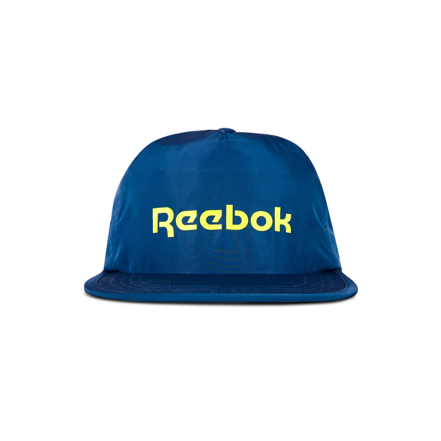 The Reebok Flat Brim Running Cap is a blue, lightweight hat with moisture-wicking fabric, featuring a flat brim and bold yellow Reebok logo on the front, shown against a white background.