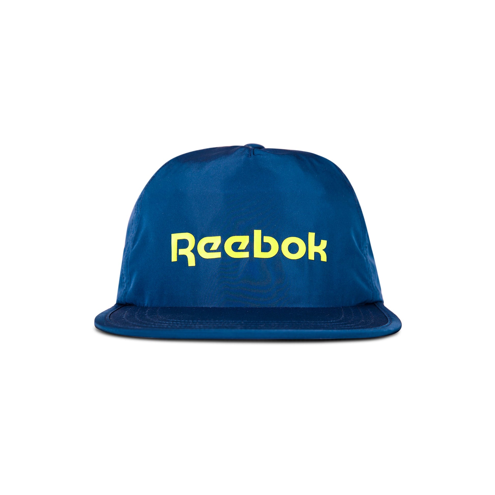 The Reebok Flat Brim Running Cap is a blue, lightweight hat with moisture-wicking fabric, featuring a flat brim and bold yellow Reebok logo on the front, shown against a white background.