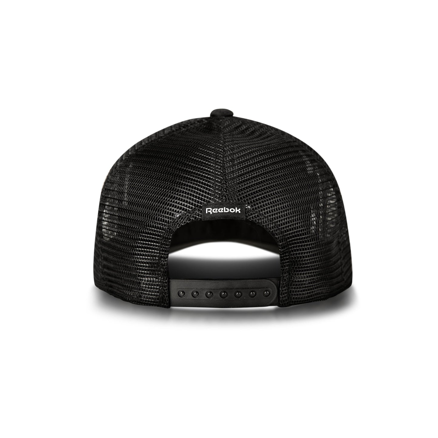 Back view of the Reebok Deluxe Aero Cap, shown on a white background, with black mesh, adjustable snapback closure, moisture-wicking sweatband, and the Reebok logo above the opening.