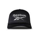 A black Reebok Deluxe Aero Cap is shown from the front with the white Reebok logo on the front panel, a curved brim, mesh sides, and an adjustable snapback closure.