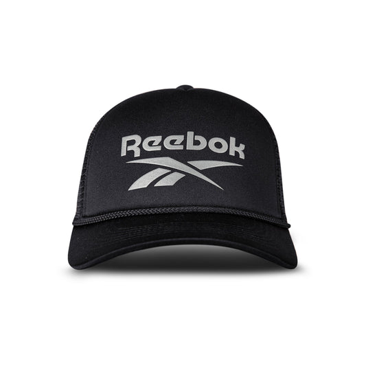 A black Reebok Deluxe Aero Cap is shown from the front with the white Reebok logo on the front panel, a curved brim, mesh sides, and an adjustable snapback closure.