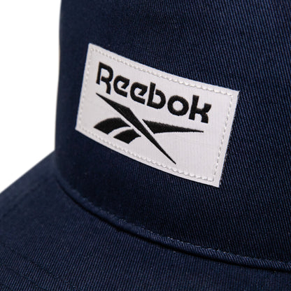 Close-up of the Reebok Classic 5 Cap in navy, showcasing a white stitched patch with black Reebok branding on the front—an ideal finishing touch for your athletic look.
