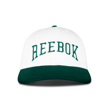 The Reebok Gameday Cap features a white crown, a dark green curved brim, and large green REEBOK embroidery on the front.