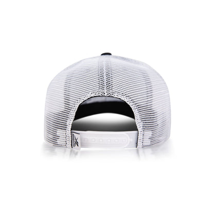Back view of the Reebok Woven Patch Vector Trucker Cap with white mesh panels and an adjustable snapback closure, shown against a white background.
