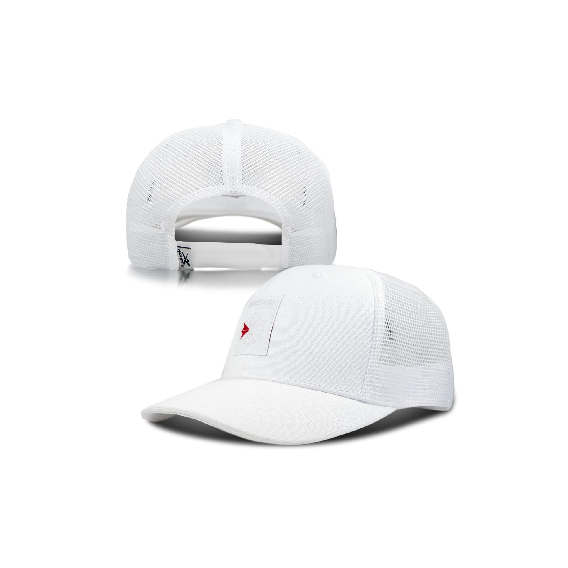 The Reebok Woven Patch Vector Trucker Cap is shown from the front and back, featuring a small red Reebok arrow logo on a white patch, plus mesh back panels and an adjustable snapback closure.