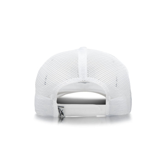 The image shows the back of the Reebok Woven Patch Vector Trucker Cap with mesh panels, an adjustable snapback closure, and a small fabric tag near the opening.