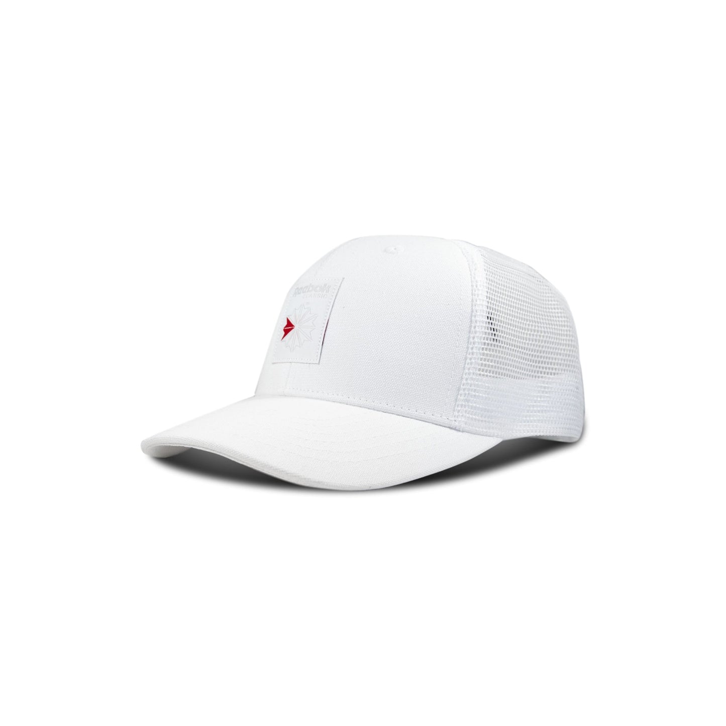 The Reebok Woven Patch Vector Trucker Cap is a white hat with mesh back panels and a front rectangular patch, shown on a plain white background.