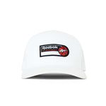 The Reebok Basketball Trucker Cap is a white snapback hat with a curved brim, featuring a logo patch and red basketball graphic on the front, perfect for adding sporty style to any look.