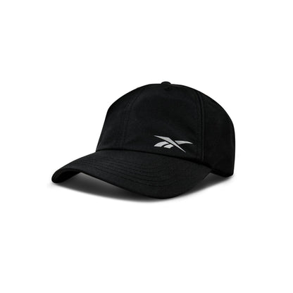 The Reebok Flow Piped Cap, in black with a curved brim and white Reebok logo on the front, features a moisture-wicking sweatband and is shown on a plain white background.
