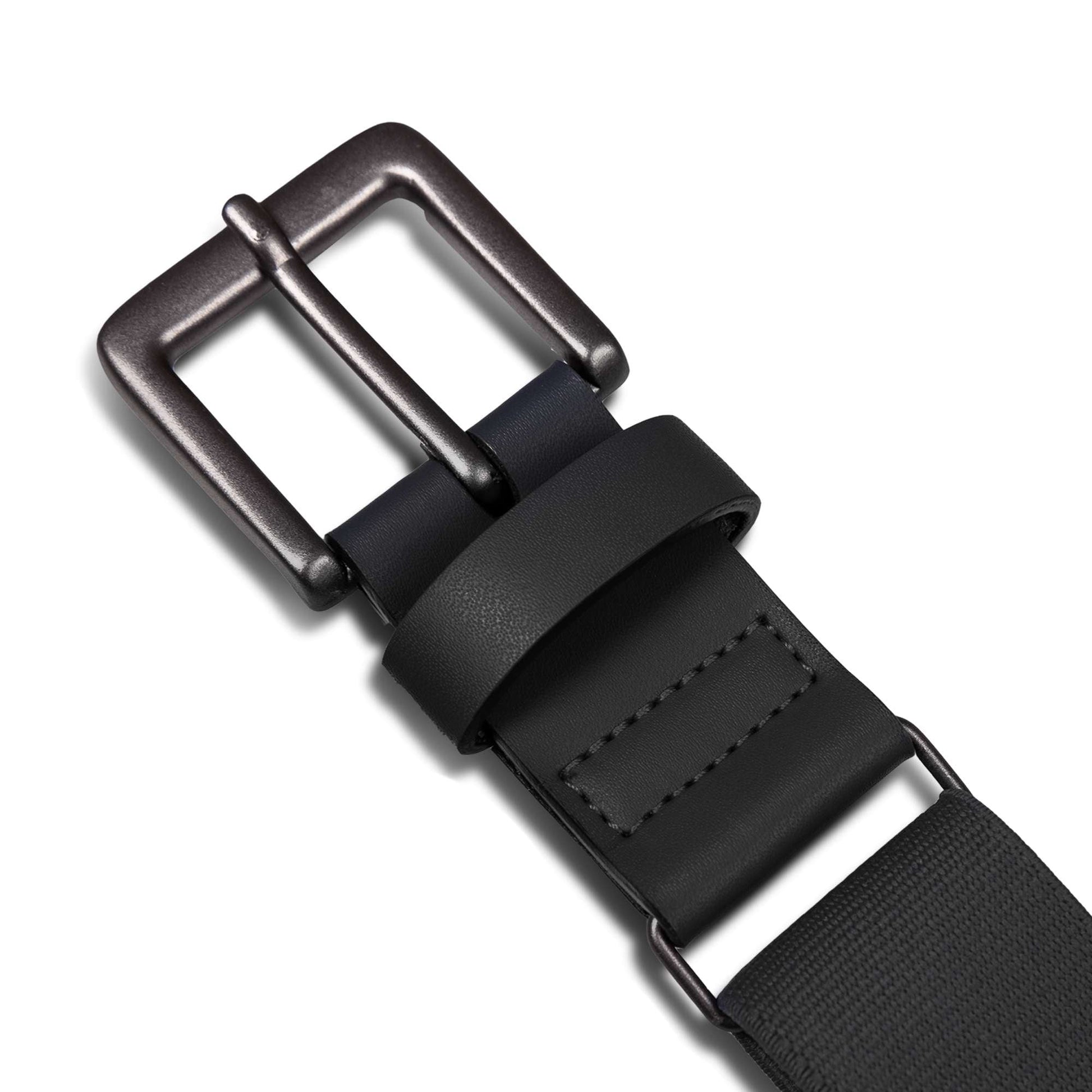 Close-up of the Reebok Youth Baseball Belt featuring a dark metal buckle, black leather loop, and visible stitching near the adjustable buckle, all set against a white background.