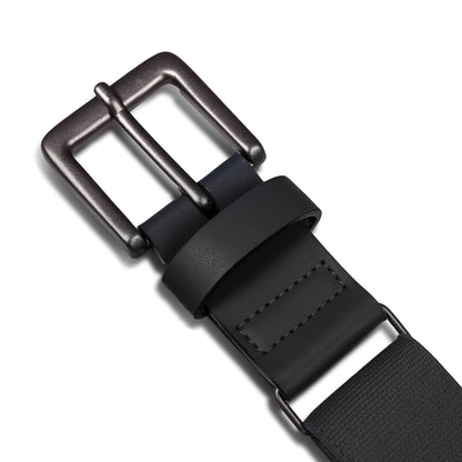 Close-up of the Reebok Youth Baseball Belt featuring a dark metal buckle, black leather loop, and visible stitching near the adjustable buckle, all set against a white background.