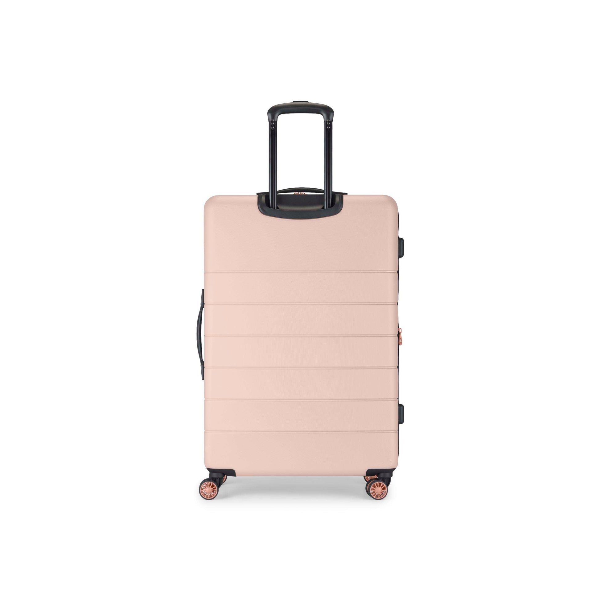A large, hard-shell suitcase in a light pink color with four wheels and a black telescopic handle, standing upright on a white background.
