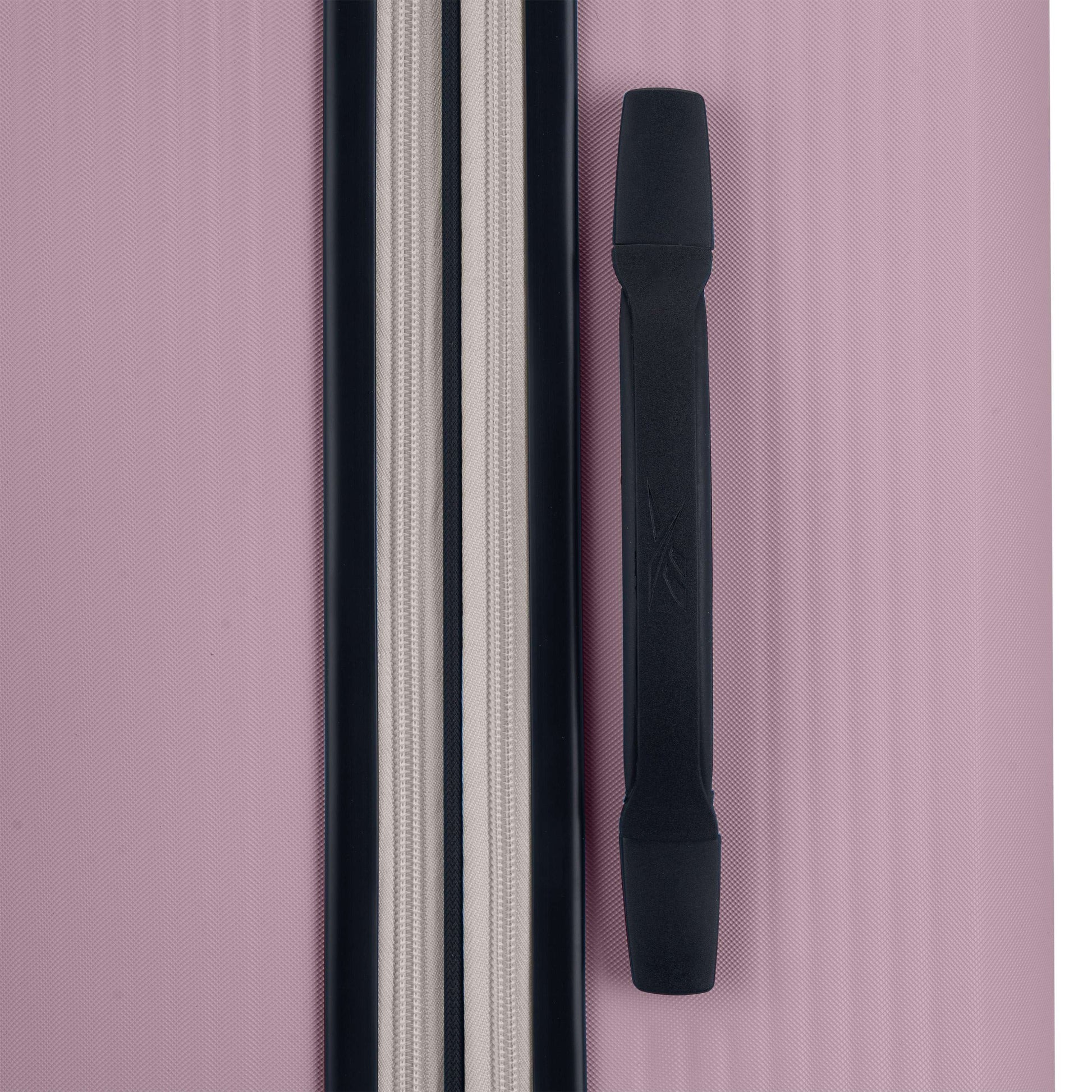 Close-up of the Reebok Action Duo 2 Piece Luggage Set in pink, featuring a textured finish, black handle, zippered compartment with black and white trim, and smooth spinner wheels for easy travel.