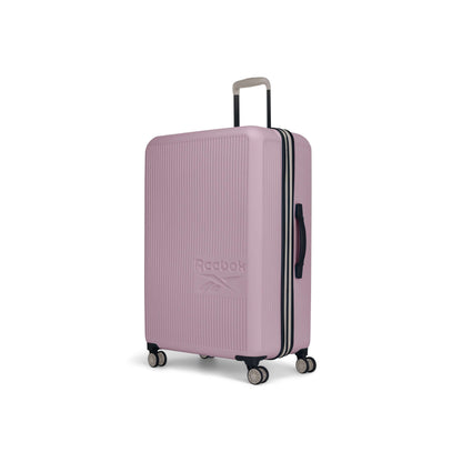 The Reebok Action Duo 2 Piece Luggage Set features a large, light pink hard-shell suitcase with four spinner wheels, a black side handle, and a silver telescopic handle, shown upright on a white background.