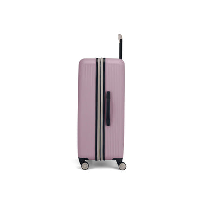 The Reebok Action Duo 2 Piece Luggage Set features a light pink suitcase with black accents, four spinner wheels, and an extended handle, displayed upright from the side against a white background.