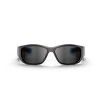 Reebok Nitrous Smart Audio Sunglasses shown front-on against a white background feature wide, wraparound frames and dark polarized lenses, offering full-coverage eye protection with a sleek curved design.