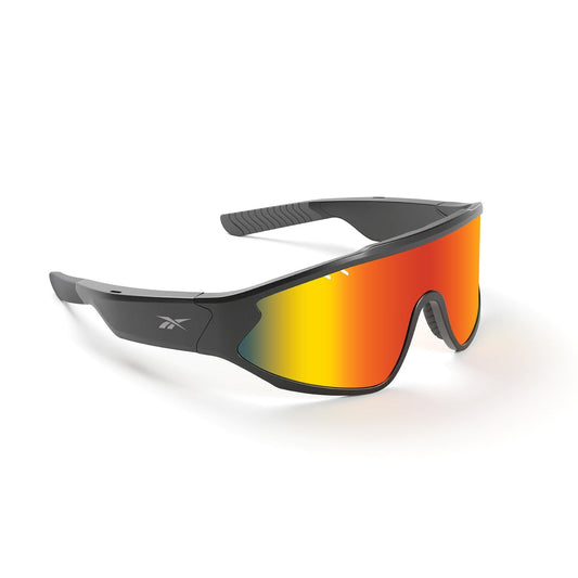 The black Reebok Voltage Smart Audio Sunglasses feature a wraparound frame, large mirrored orange-yellow gradient polarized lenses, and a small Reebok logo on the temples, shown against a plain white background.