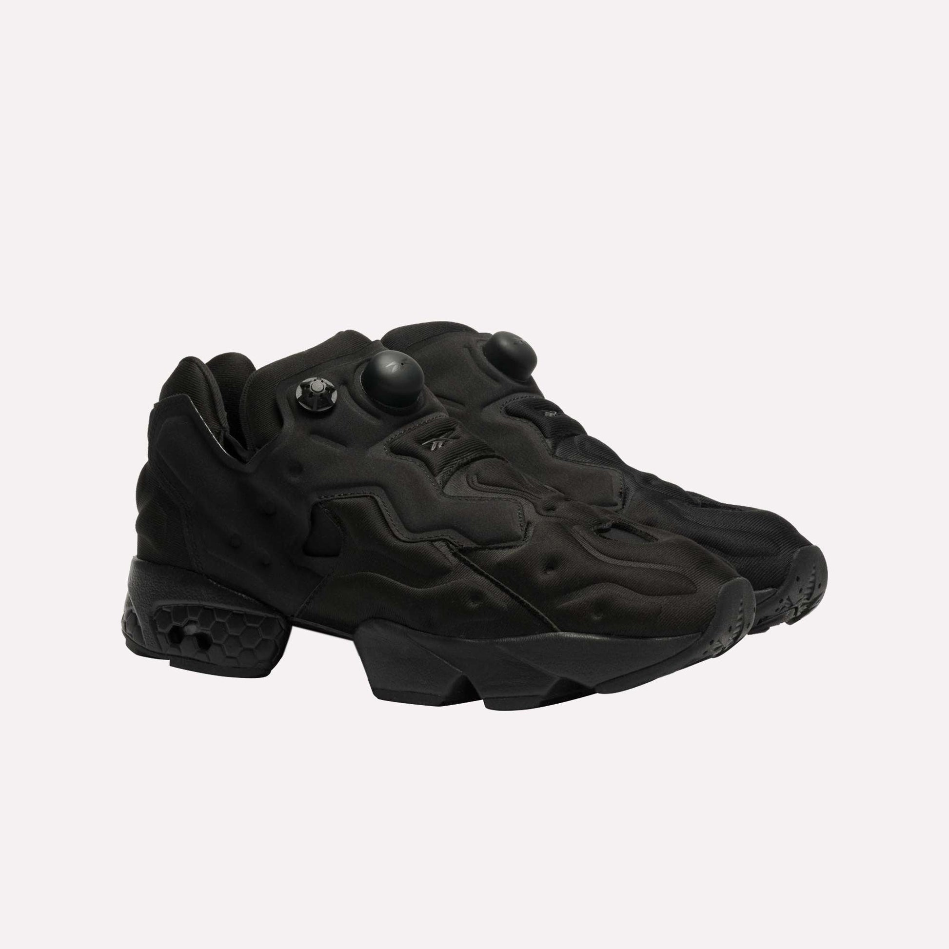 The Reebok Instapump Sliver LTD Shoes are all-black athletic sneakers with a textured futuristic design, chunky soles, and Hexalite cushioning, shown against a plain white background.