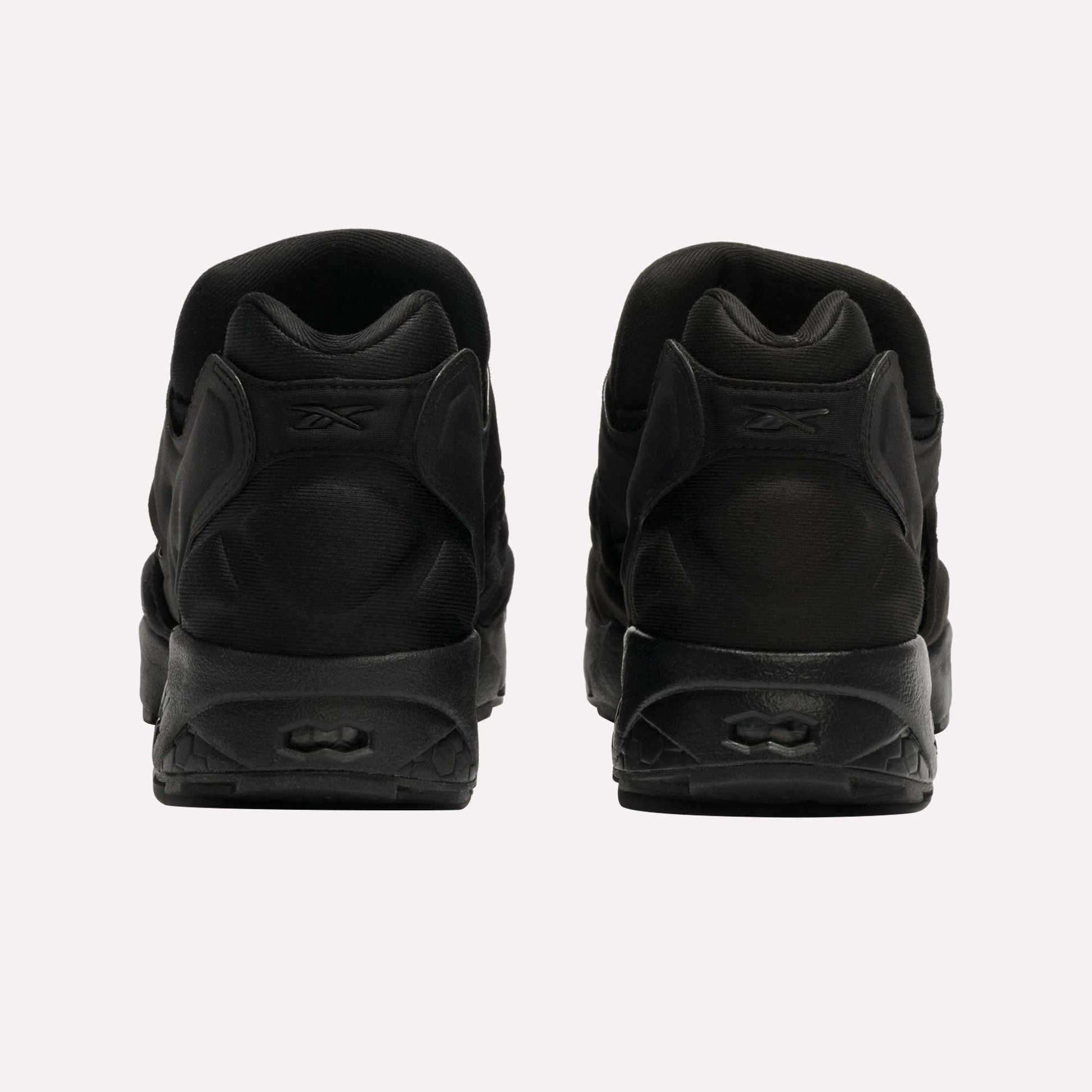 The Reebok Instapump Sliver LTD Shoes are shown from the back on a plain white background, placed side by side to highlight their heel and sole details.