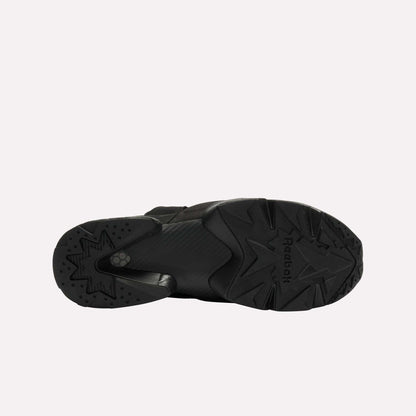 Bottom view of a single black Reebok Instapump Sliver LTD shoe with a chunky rubber sole, star-patterned tread, Hexalite cushioning, and the Reebok logo visible against a plain white background.