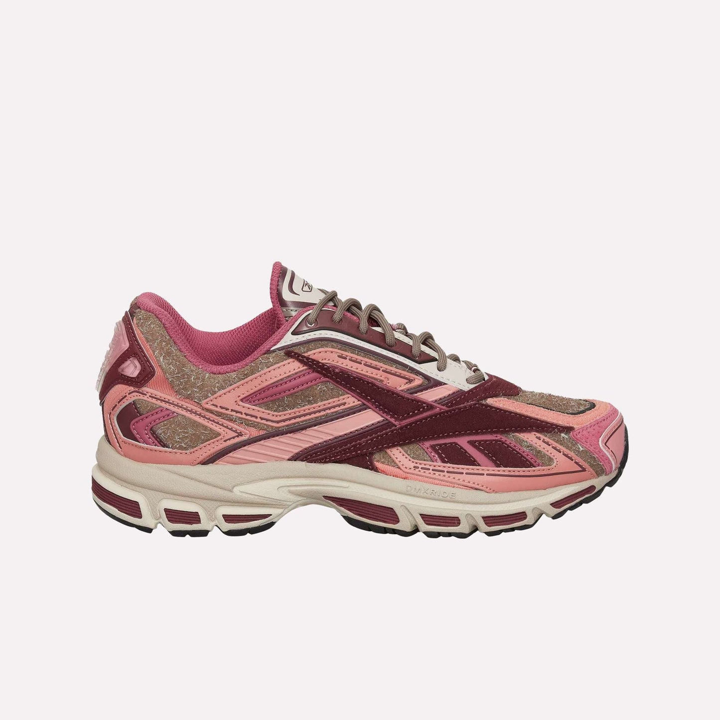 The Reebok Premier Road Ultra Shoes are stylish running sneakers in pink, burgundy, and light brown with mesh and suede uppers, a dual-density midsole, a white sole with dark accents, and a sporty, layered design.