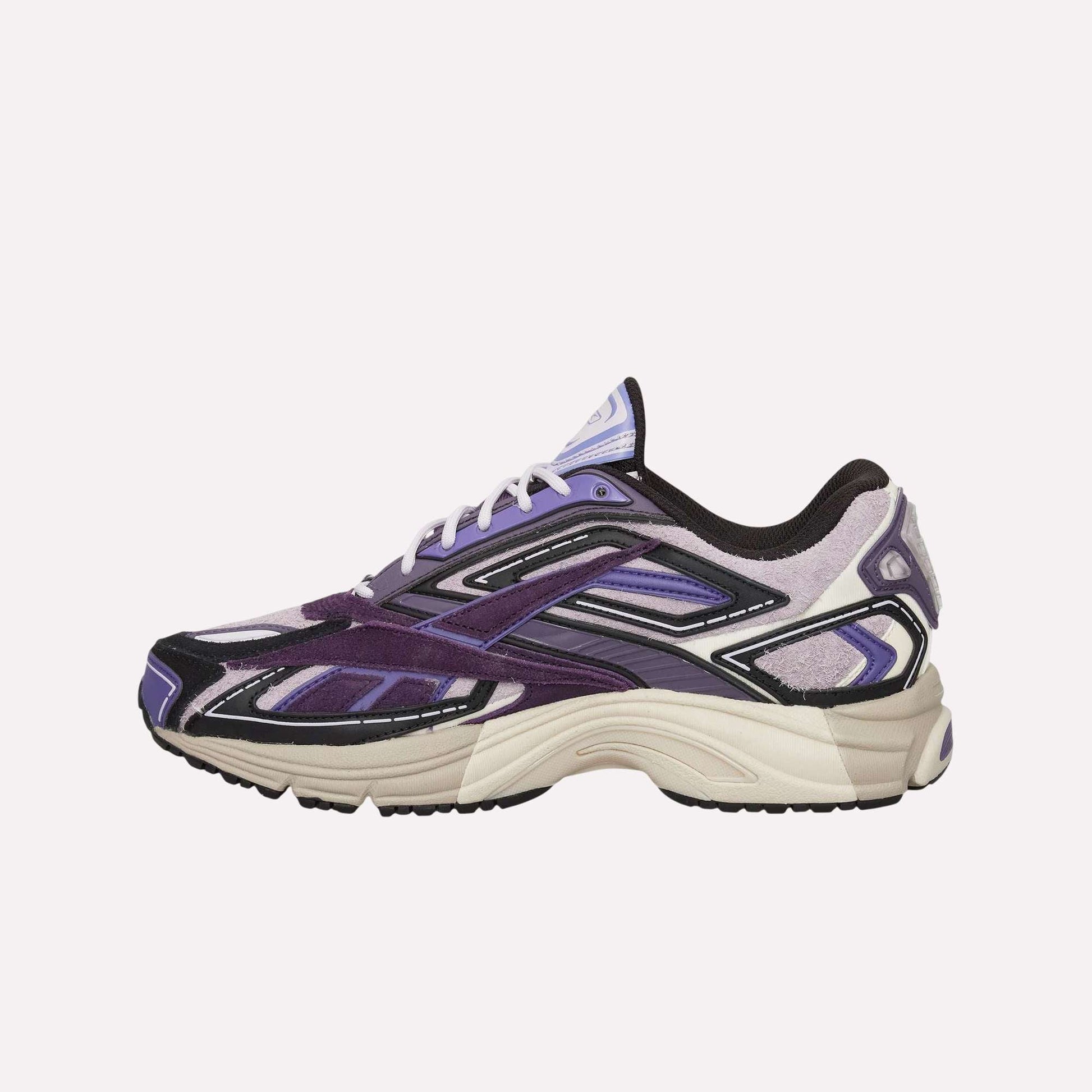 The Reebok Premier Road Ultra Shoes are athletic sneakers featuring layered panels in purple, lavender, black, and beige with white laces and a textured sole for a modern take on archival running style.