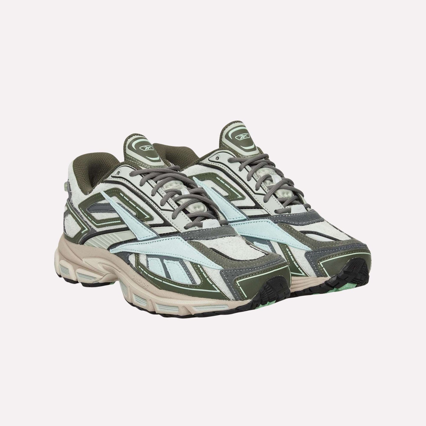 Reebok Premier Road Ultra Shoes with olive green, grey, white, and light blue panels and thick dual-density midsoles are shown against a plain light blue background.