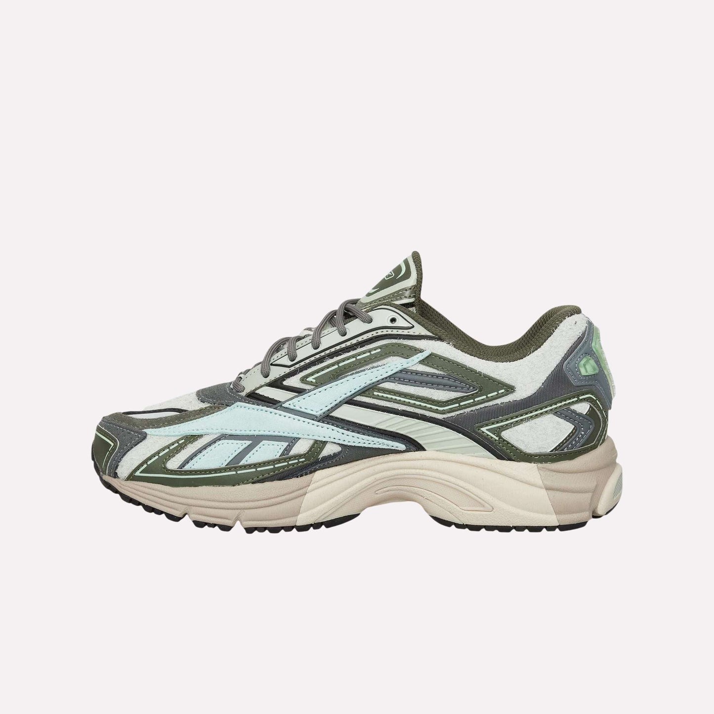 The Reebok Premier Road Ultra Shoes feature a beige sole, olive green and light blue upper, dual-density midsole, black accents, and grey laces, shown against a light blue background.
