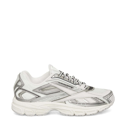 The Reebok Premier Road Ultra Shoes in white with silver and gray accents feature a mesh upper, lace-up closure, and thick textured sole. This archival sneaker is displayed from a side profile against a plain white background.