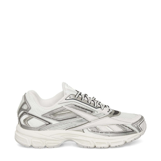 The Reebok Premier Road Ultra Shoes in white with silver and gray accents feature a mesh upper, lace-up closure, and thick textured sole. This archival sneaker is displayed from a side profile against a plain white background.
