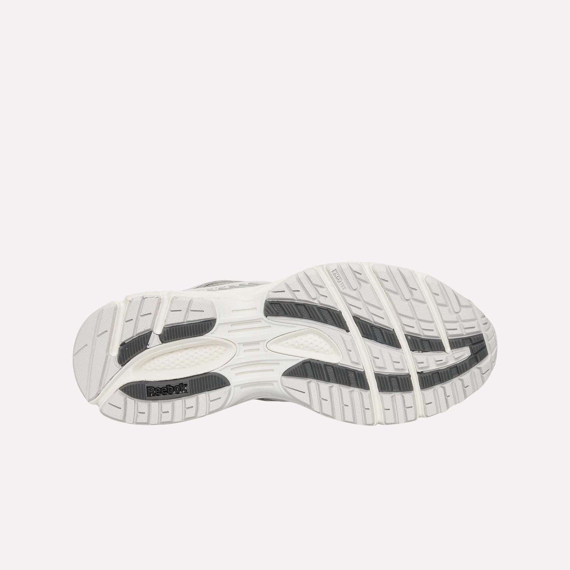 The bottom view shows the white Reebok Premier Road Ultra Shoes sole with black and gray traction, designed for grip and stability, complementing this archival running sneaker’s dual-density midsole.
