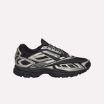 The Reebok Premier Road Ultra Shoes feature a black mesh upper with metallic silver accents, black laces, angular patterns, a chunky dual-density rubber sole, and boast a modern, sporty look.