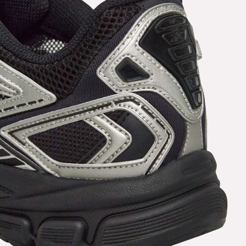 Close-up of the heel and side of Reebok Premier Road Ultra Shoes, featuring silver and gray accents, a textured mesh upper, and a thick, sculpted dual-density midsole.