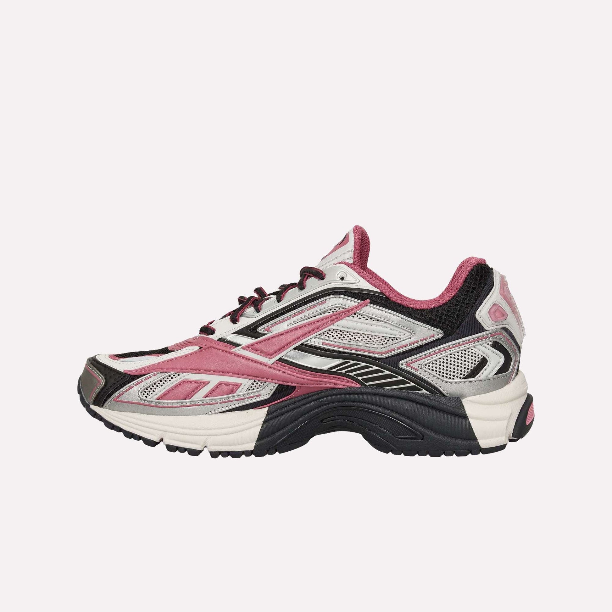 The Reebok Premier Road Ultra Shoes in white, black, and pink feature mesh and synthetic uppers, black laces, a dual-density midsole, and textured sole. Shown in profile against a white background.