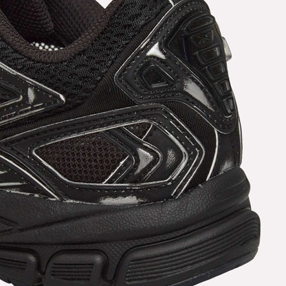 Close-up of the heel and side of Reebok Premier Road Ultra Shoes, highlighting textured mesh, glossy synthetic overlays, detailed stitching, and the dual-density midsole.