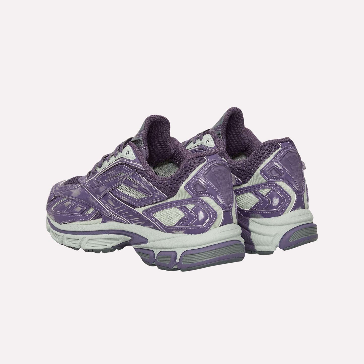 The Reebok Premier Road Ultra Shoes are purple and gray running sneakers with mesh and synthetic overlays, chunky soles, and a dual-density midsole for comfort, shown from the rear and slightly to the side.