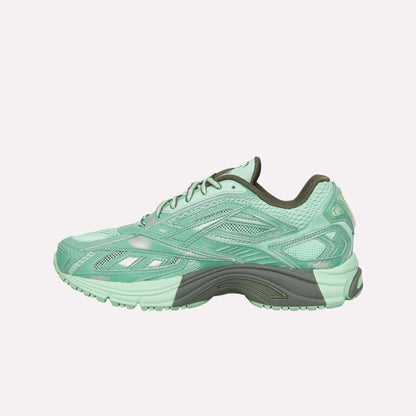 The Reebok Premier Road Ultra Shoes are mint green running sneakers with dark green accents, mesh and synthetic overlays, a dual-density midsole, textured sole, and lace-up closure, shown in profile against a white background.