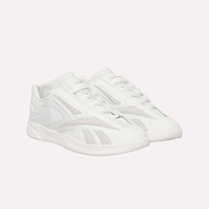 A pair of Reebok Hammer Pro LTD Shoes in white faux leather with a sleek low-top design, subtle textured patterns, and durable rubber soles, displayed side by side on a white background.