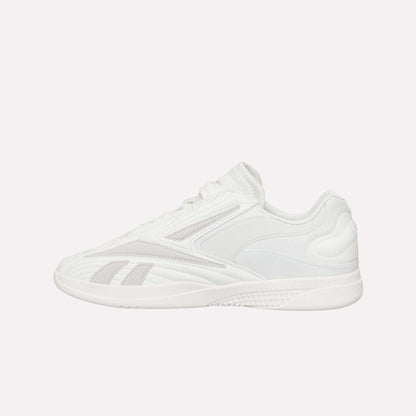 A white Reebok Hammer Pro LTD Shoe with light gray accents, a durable rubber sole, lace-up closure, and smooth faux leather panels, shown from the side on a plain white background.