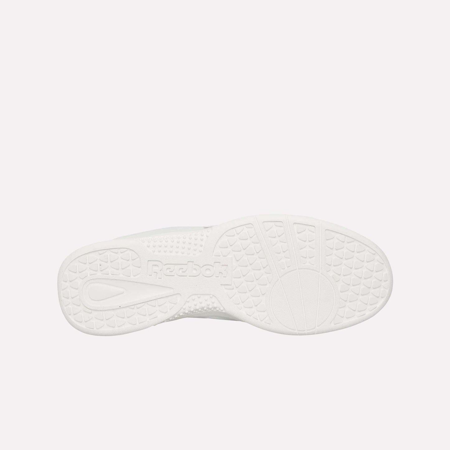 The image displays the bottom of a white Reebok Hammer Pro LTD Shoes sole, highlighting its textured grip patterns, durable rubber construction, and an embossed Reebok logo near the center.