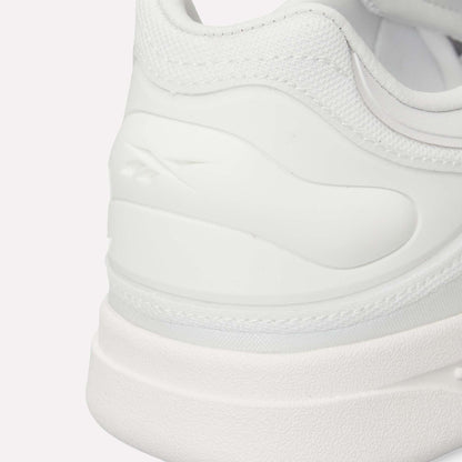 Close-up of the heel and side of Reebok Hammer Pro LTD Shoes with a subtle logo embossed on textured faux leather. Smooth and mesh materials combine with a durable rubber sole for a clean, minimalistic look.