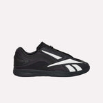 The Reebok Hammer Pro LTD Shoes, black faux leather low-tops with white stripes and a durable rubber sole, are shown in side profile against a plain white background.