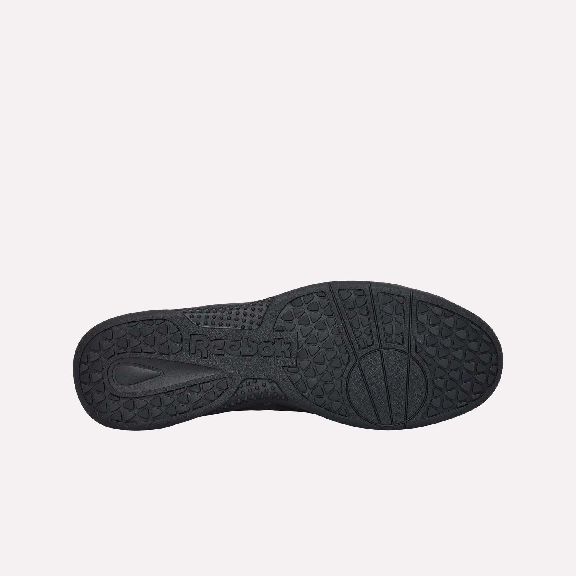 The image displays the black durable rubber sole of Reebok Hammer Pro LTD Shoes from below, highlighting textured patterns and the word "Reebok" embossed near the arch.