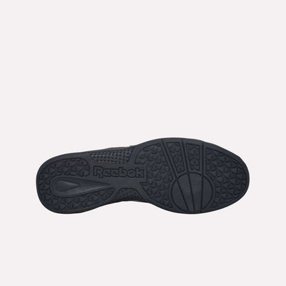 The image displays the black, durable rubber sole of the Reebok Hammer Pro LTD Shoes, showcasing textured grip patterns and a molded Reebok logo in the center.