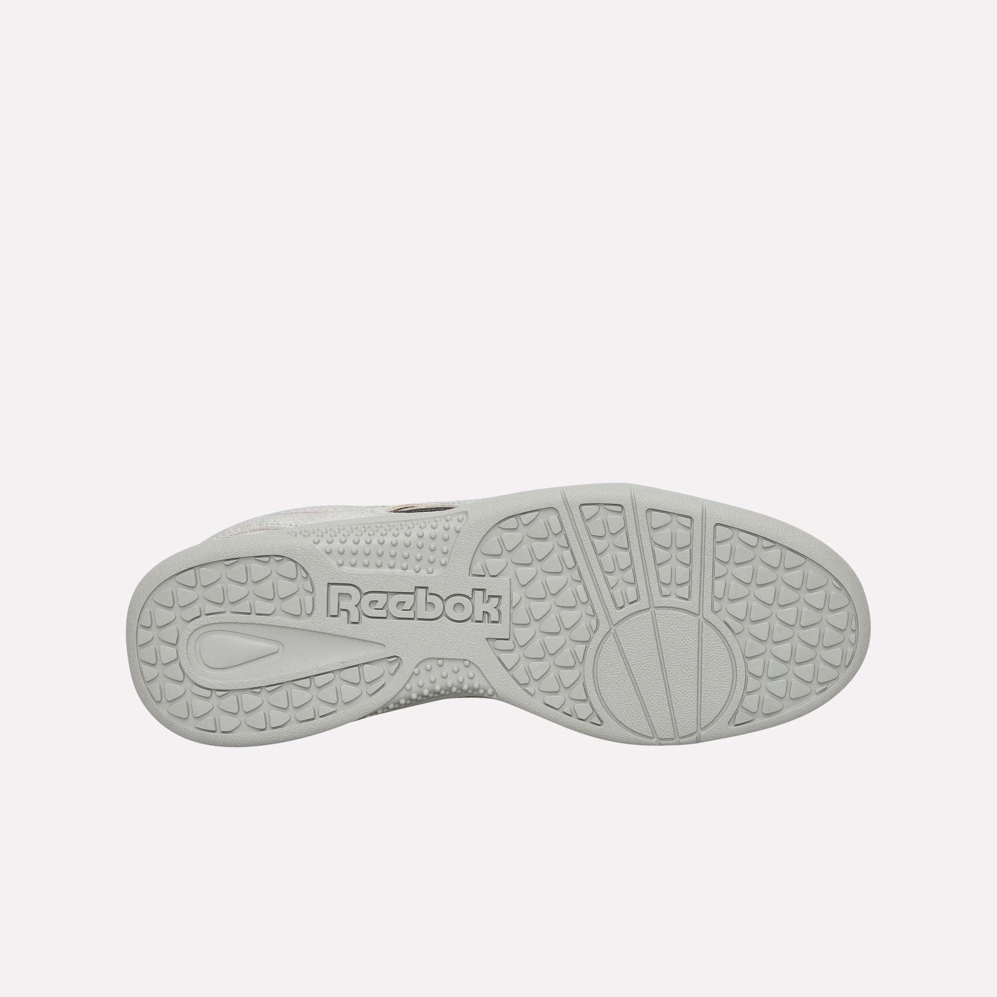 The image shows the white sole of Reebok Pleasures Hammer Street Shoes against a light blue background, featuring textured grip patterns and the embossed Reebok logo in the center.