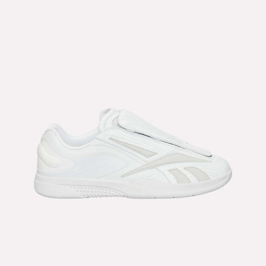 The Reebok Hammer Pro Ltd is a white low-profile sneaker with a smooth and perforated design, layered details, a lace flap, a suede upper, and a durable rubber sole for grip.