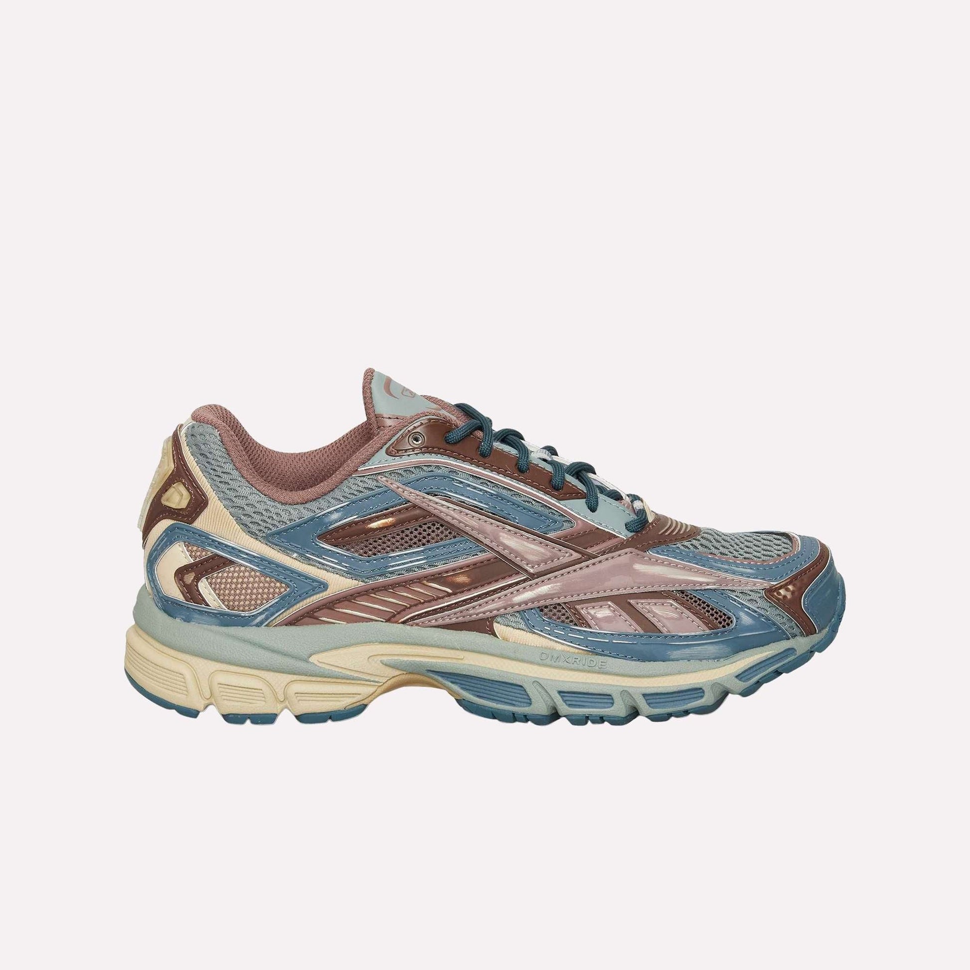 The Reebok Premier Road Ultra LTD Shoes, shown from the side against a plain light background, feature blue, beige, and brown mesh and synthetic overlays. Inspired by archival running silhouettes, these athletic sneakers are equipped with a dual-density midsole for enhanced comfort and support.