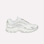 The Reebok Premier Road Ultra LTD Shoes are displayed in a side view against a plain white background. This white athletic running sneaker features gray accents, mesh panels, and a dual-density midsole. Inspired by the original Reebok Premier Road Ultra, the design includes a textured rubber sole for enhanced traction and comfort.
